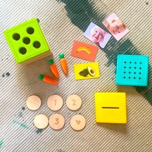 Lovevery Wooden Coin Bank Set plus cards, carrot lid, carrots, and posting lid